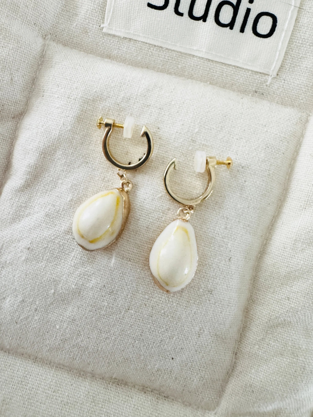 Handmade small white shell clip-on earrings